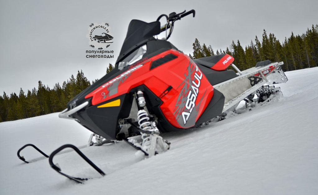 Собираетесь гонять в горах? Возьмите Polaris RMK Assault с гоночным траком, ставший по нашему мнению лучшим снегоходом для горных гоночных заездов.